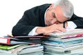 Man lying on paperwork Royalty Free Stock Photo