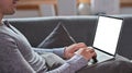 Man lying on sofa and surfing internet with laptop. Royalty Free Stock Photo