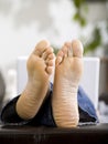 Man lying with white laptop