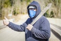 Man with machete try to stop car Royalty Free Stock Photo