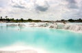 Man-made artificial clear blue lake Kaolin, mining ground holes covered by rain water.