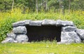 Man made cave, overgrown with grass Royalty Free Stock Photo