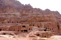 The man-made caves carved in red mountain in Petra - the capital of the Nabatean kingdom in Wadi Musa city in Jordan Royalty Free Stock Photo