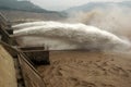 A man-made dam outlet flood peak. Royalty Free Stock Photo