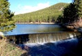 Small Dam in Lake With Nearby Forest Royalty Free Stock Photo
