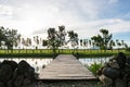 A man made dock and a pond with a view of nature Royalty Free Stock Photo