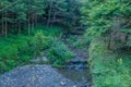 Man made stream with stone terraces in mountain park