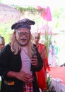 A man made up to portray the character of Ki Lengser in a traditional Sundanese wedding ceremony.