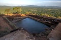 The man made water tank chisled out of solid rock which sits at the summit of Sigiriya Rock Fortress in Sri Lanka.