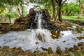 Man-made waterfall in Macintosh Island park. Royalty Free Stock Photo