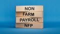 Man made word NFP with wood blocks. Wooden cube blocks