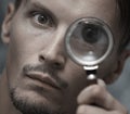 Man with magnifying glass Royalty Free Stock Photo