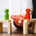 A man makes contact between people opponents. Arbitrator and mediator. Build bridges, seek a compromise in disputes Royalty Free Stock Photo