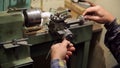 Man makes detail on lathe