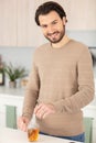 man makes himself cup tea at home Royalty Free Stock Photo