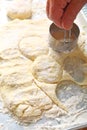 Man makes homemade biscuits, vertical view