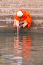 Man makes ritual washing in the Ganges river, Varanasi