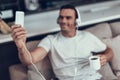 Man Makes Selfie in Headphones while Drink Coffee Royalty Free Stock Photo