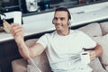Man Makes Selfie in Headphones while Drinking Tea Royalty Free Stock Photo