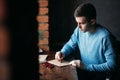 Man makes the stamp using sealing wax on the envelope