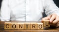 Man makes up the word Controls. Business and process management concept. Control Monitoring compliance with rules