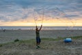 Man making big Soap Bubbles on the sandy beach Royalty Free Stock Photo
