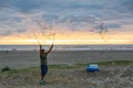 Man making big Soap Bubbles on the sandy beach Royalty Free Stock Photo