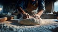 A man is making bread dough on a table Royalty Free Stock Photo