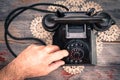 Man making a call on a rotary telephone Royalty Free Stock Photo