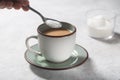 Man making coffee with milk and sweetener Royalty Free Stock Photo