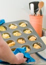 Man making cornmeal muffins Royalty Free Stock Photo