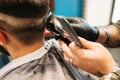 Man making curly haircut at barber shop closeup Royalty Free Stock Photo