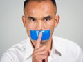 The man making finger on lips silence gesture, pst, shh Royalty Free Stock Photo