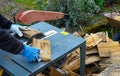 Man making firewood with buzz saw Royalty Free Stock Photo