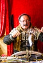 A man is making glass Christmas balls at the Merano Christmas Market