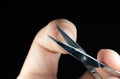 Man is making a manicure scissors. Procedures at home. Cutting nails Royalty Free Stock Photo