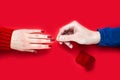 Man making marriage proposal and puts a ring on a girl's finger. Close-up. Top view