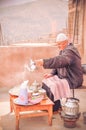 Man making mint tea in Morrocco Royalty Free Stock Photo