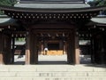 Man Making Offering at Temple in Japan