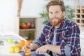 Man making orange juice Royalty Free Stock Photo