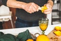 The man making orange juice at home. Preparation of orange juice. Health concept. Soft focus Royalty Free Stock Photo