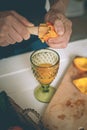 The man making orange juice at home. Preparation of orange juice. Health concept. Soft focus Royalty Free Stock Photo