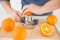 man making orange juice with juicer Royalty Free Stock Photo