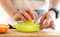 Man making orange juice at kitchen Royalty Free Stock Photo