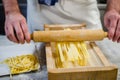 Man making pasta alla chitarra Royalty Free Stock Photo