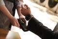 Man making payment with smart watch outdoors, closeup Royalty Free Stock Photo