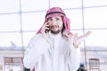 Man making a phone call in airport terminal Royalty Free Stock Photo