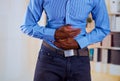 Man making pressure with both hands in his stomach, strong pain Royalty Free Stock Photo