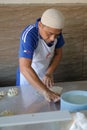 Man making roti canai in Muadzam Shah, Malaysia