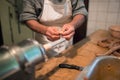 Man making sausages the traditional way using sausage filler. Royalty Free Stock Photo